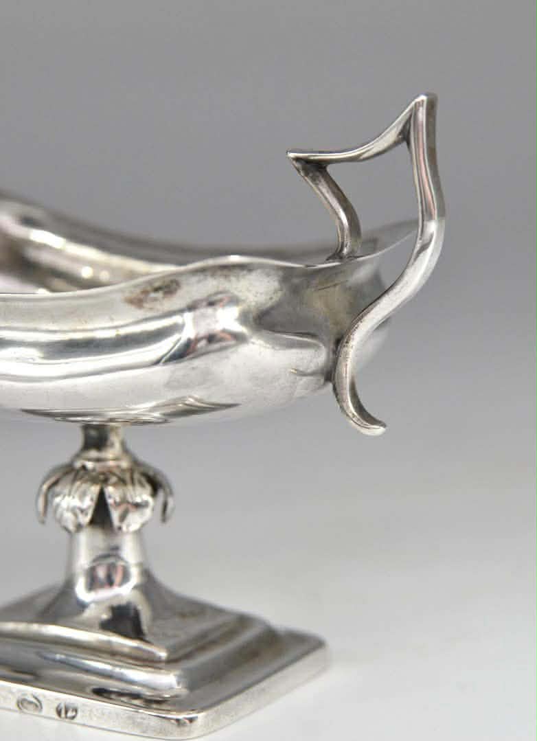 A pair of silver salt shakers 5