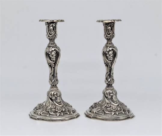 A pair of silver candlesticks 6