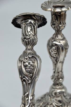 A pair of silver candlesticks 2