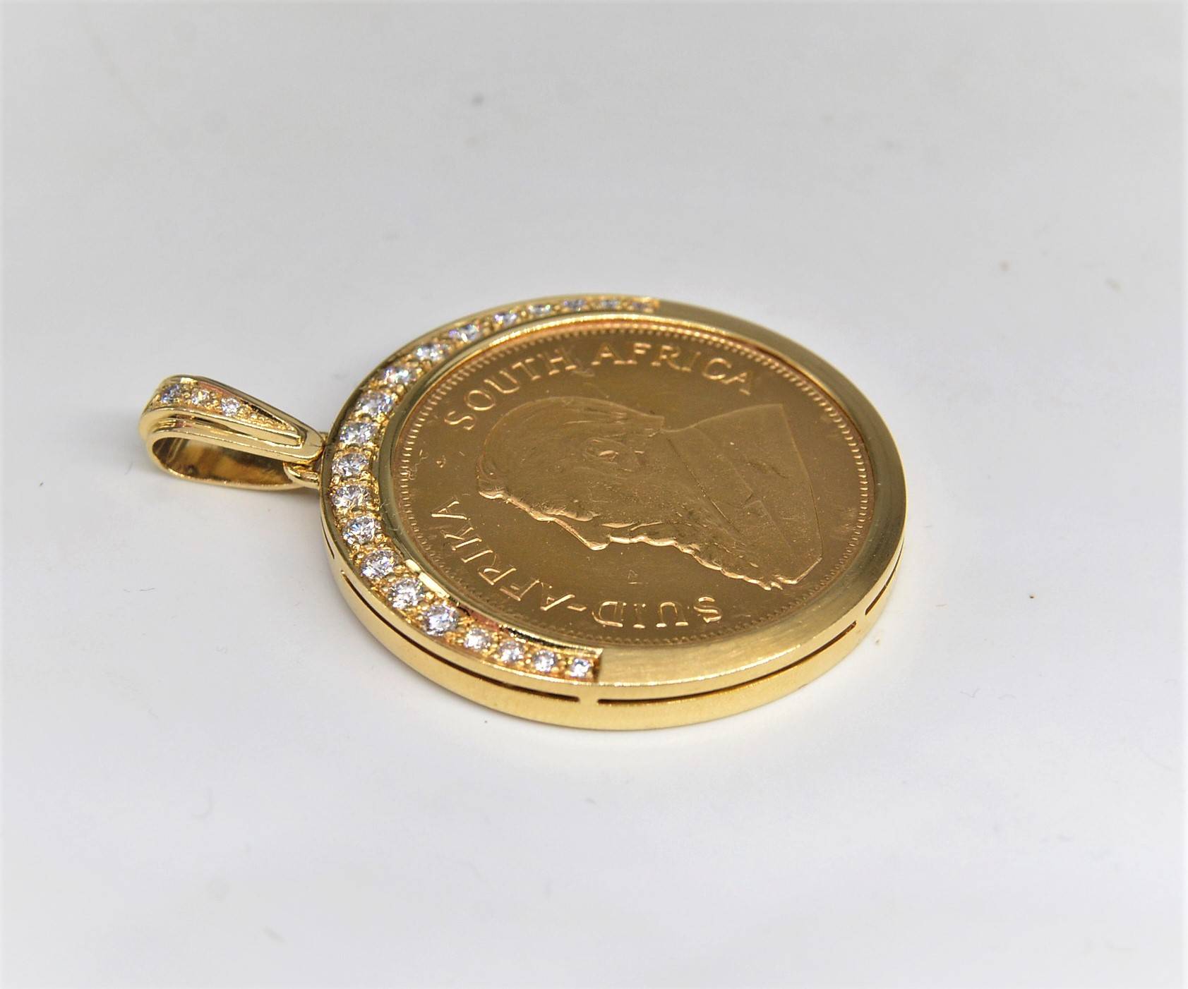 Medallion with embedded gold Krugerrand 1