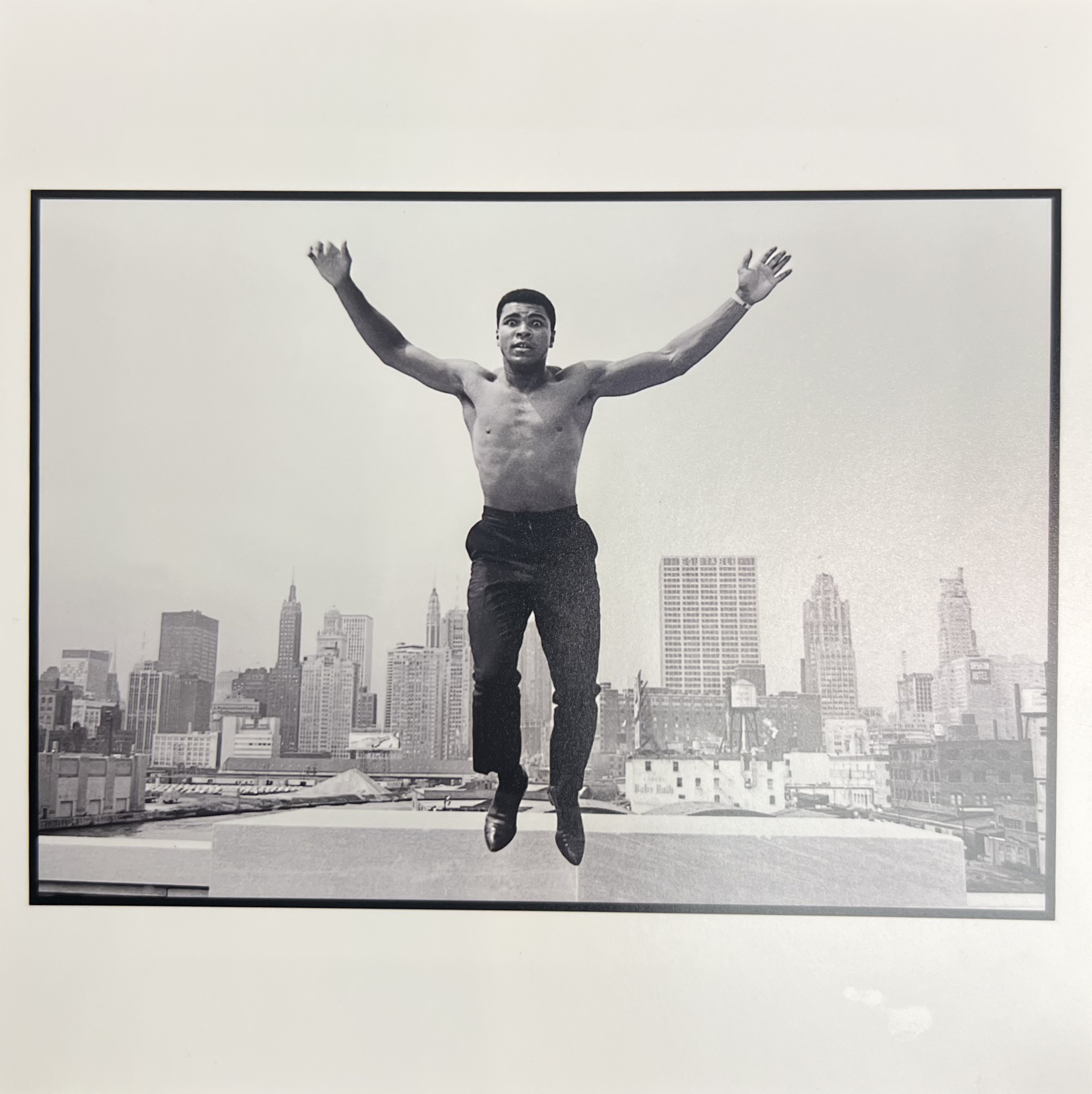 Muhammad Ali, jumping from a bridge over the Chicago River, 1966