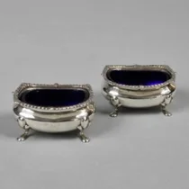 A pair of silver salt shakers
